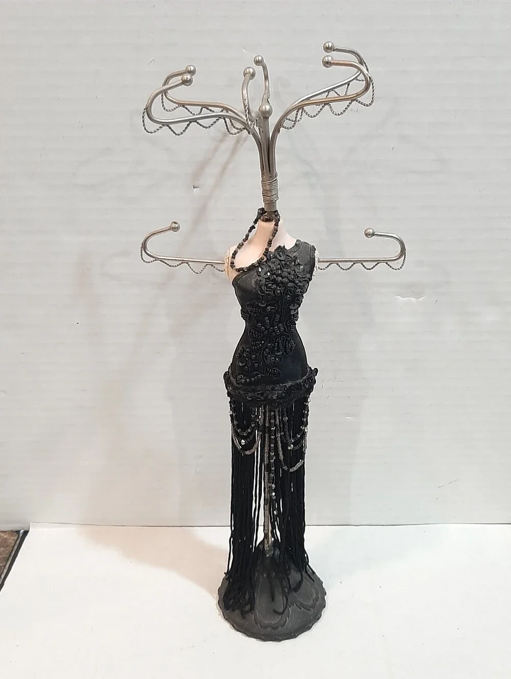 Black fringed flapper dress jewelry display stand